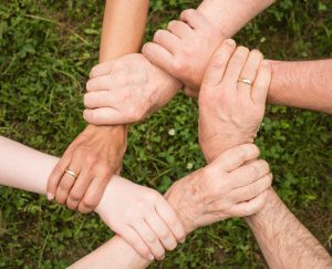 Children’s hands joined in a circle
