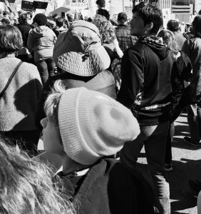 Young people standing together at a public gathering