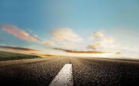 Open road seen through a car windshield